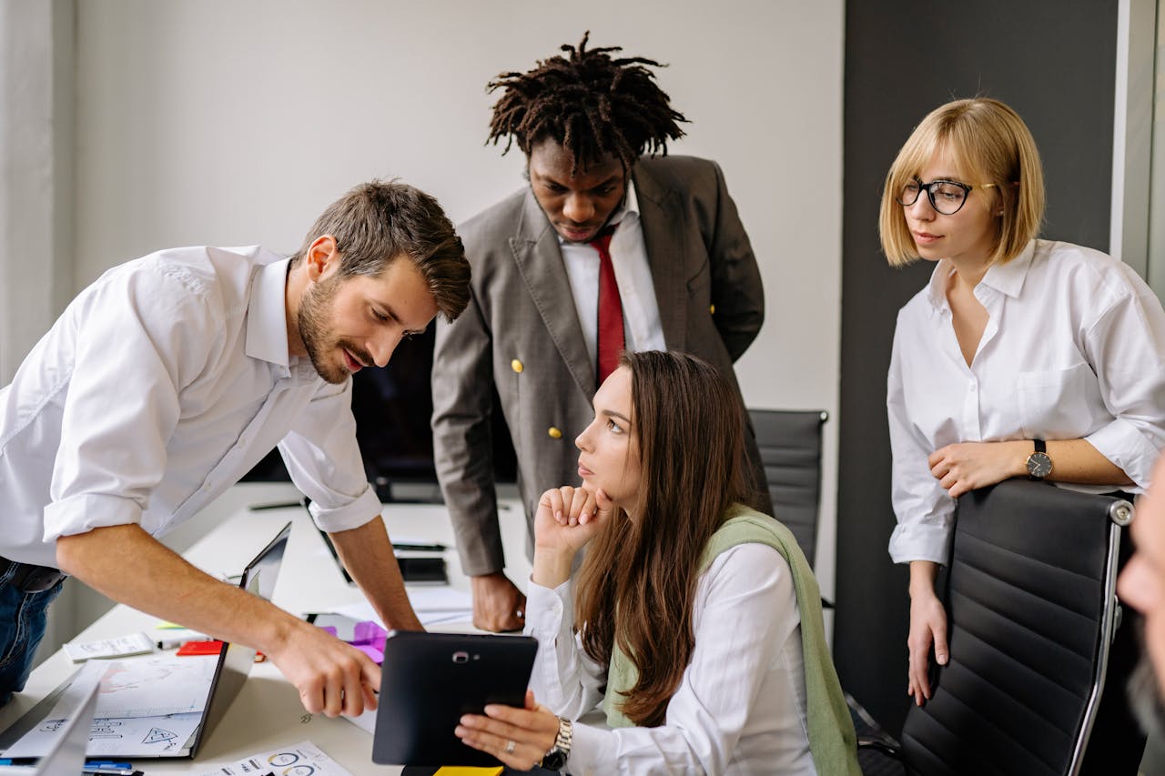 Home A group of professionals engaging in a collaborative business meeting in a modern office.